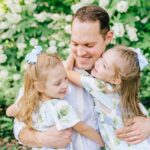 Photo of Dr. Lewis with his daughers