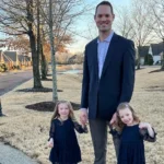 Photo of Dr. Lewis with his daughters