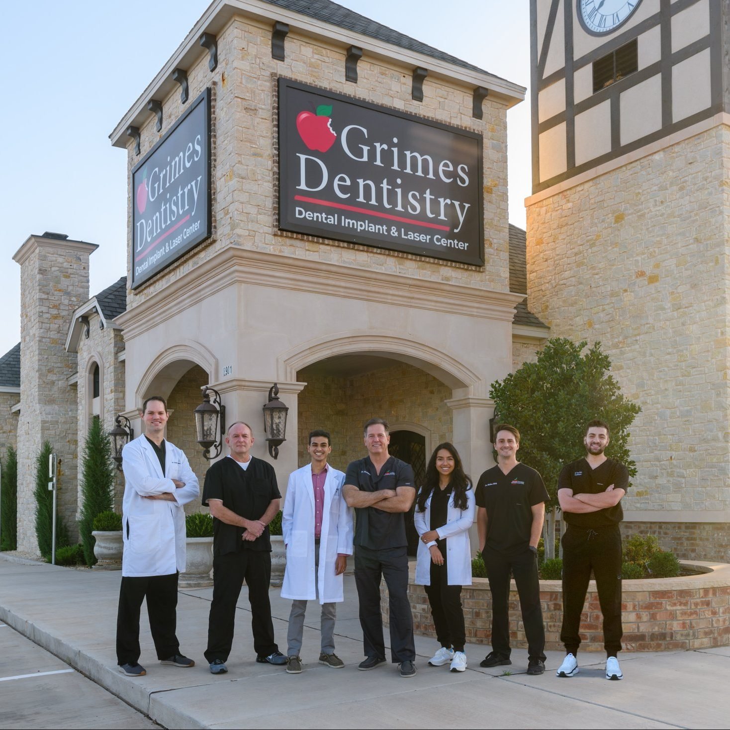 Photo of the Grimes Dentistry team standing in front of their office