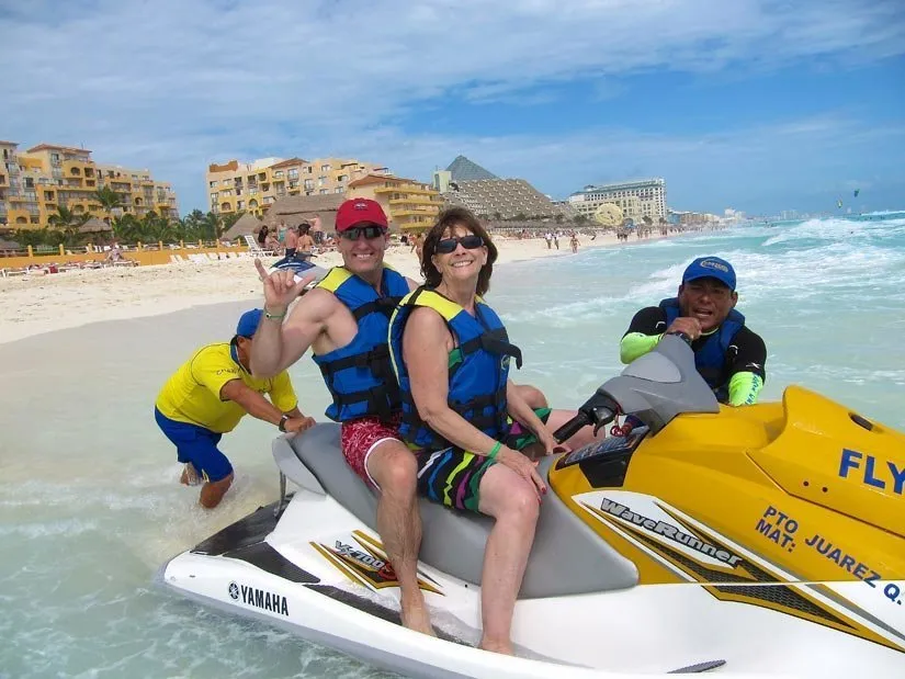 Dr. Grimes and a staff member on a water scooter