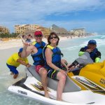 Dr. Grimes and a staff member on a water scooter